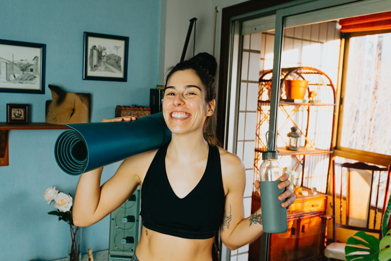 Woman with kettlebell at home - strength training equipment and home exercise routine